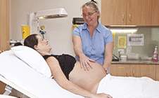 Nurse checking pregnant patient
